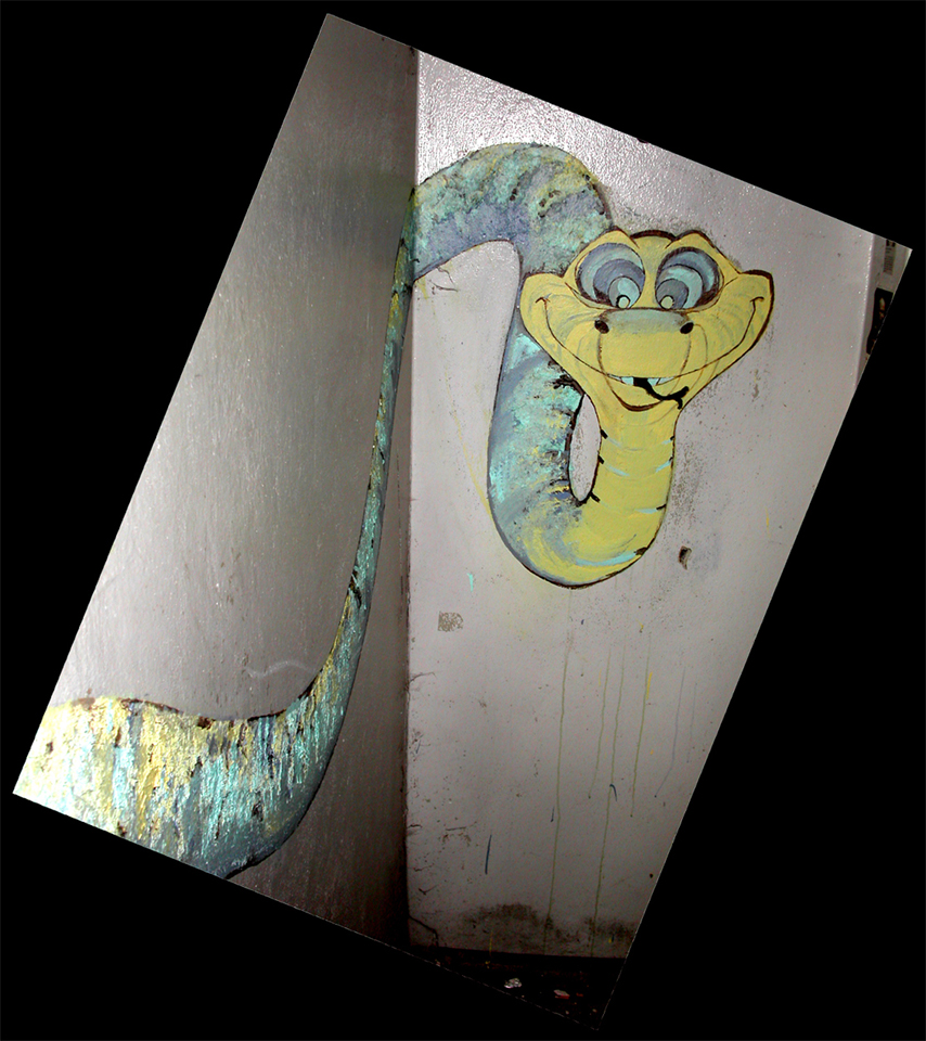 Painted cartoon snake on a metal surface